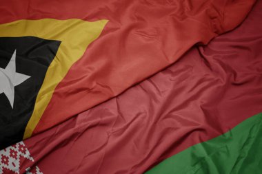 Beyaz Rusya 'nın renkli bayrağı ve Doğu Timor' un ulusal bayrağı sallanıyor. makro