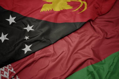 Beyaz Rusya bayrağı ve Papua Yeni Gine bayrağı sallıyordu. makro