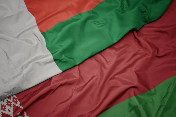 Zwaaiende Vlag Van Belarus Nationale Vlag Van Madagascar Macro — Stockfoto