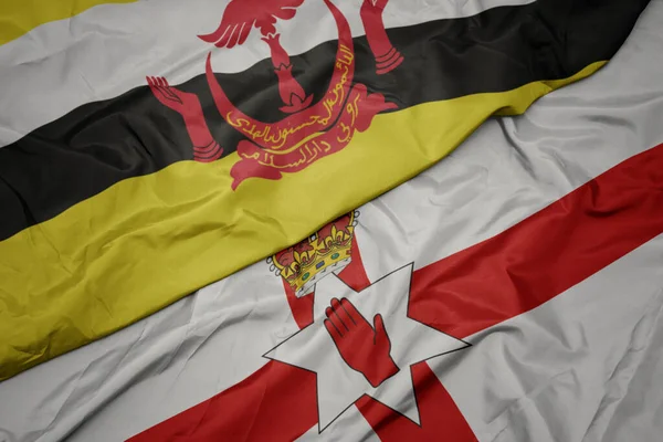 Mávající Barevnou Vlajkou Severního Irska Národní Vlajkou Bruneje Makro — Stock fotografie