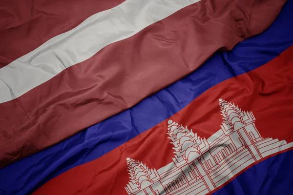 Acenando Bandeira Colorida Cambodia Bandeira Nacional Latvia Macro — Fotografia de Stock