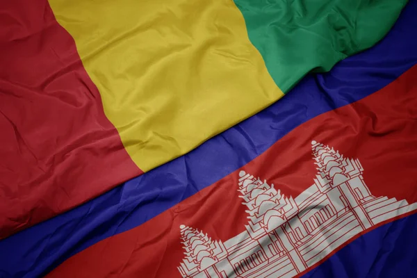 Machanie Kolorową Flagą Kambodży Narodową Flagą Gwinei Makro — Zdjęcie stockowe