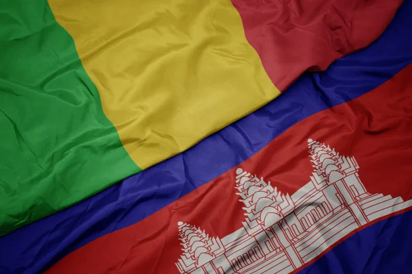 カンボジアのカラフルな旗とマリの国旗を振っています マクロ — ストック写真