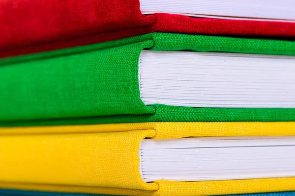 Multicolored book textile cover. Photobooks on a white background. — Stock Photo, Image