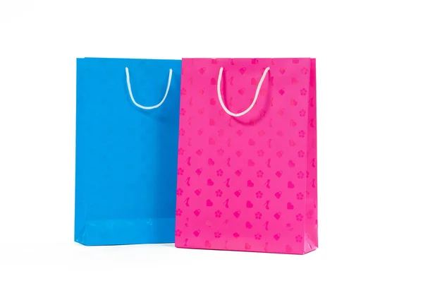 Bolsa de papel rosa y azul aislada sobre fondo blanco . —  Fotos de Stock