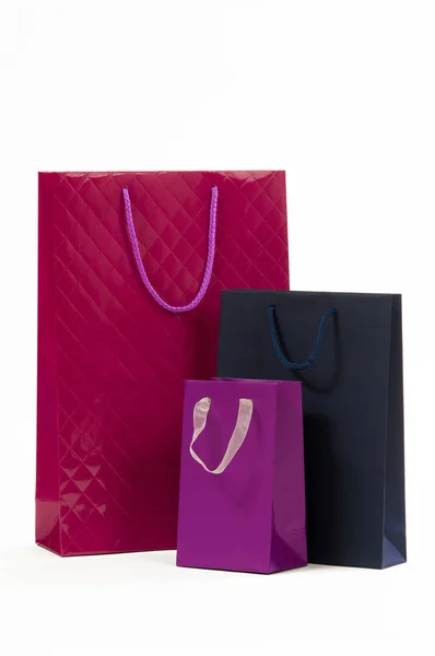 黑暗的蓝、 褐红色和紫色纸袋，在白色背景上 — 图库照片