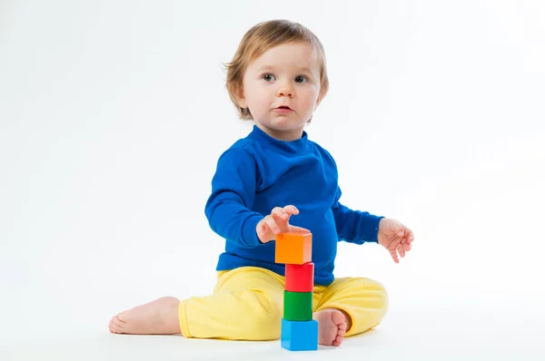 Little child playing with dices isolated on white background — Stock Photo, Image