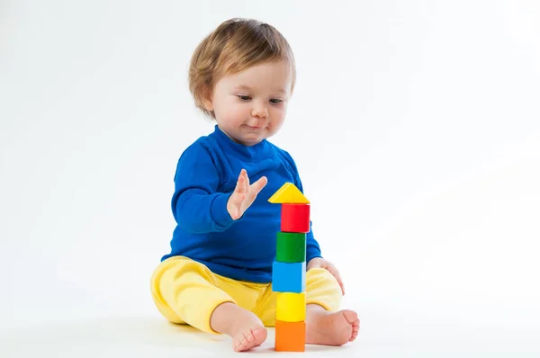 Little child playing with dices isolated on white background — Stock Photo, Image