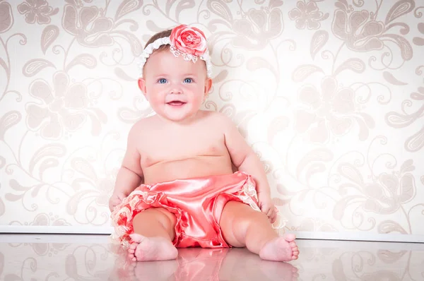 Fashionable smiling baby girl in pink panties — Stock Photo, Image