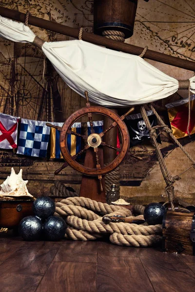 Pirates ship deck with steering wheel and flag