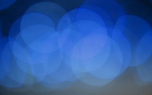 Luminose bokeh macchie rotonde blu, astratte e sfocate — Foto Stock