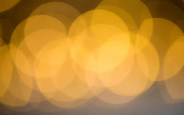 Bokeh est une couleur dorée, l'éclat des lumières est le fond. Déconcentrés — Photo