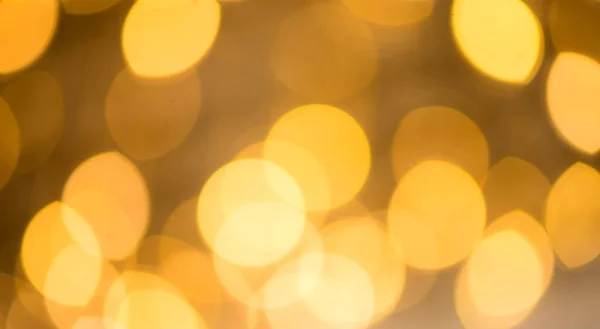 Bokeh è un colore dorato, il luccichio delle luci fa da sfondo. Sfocato — Foto Stock