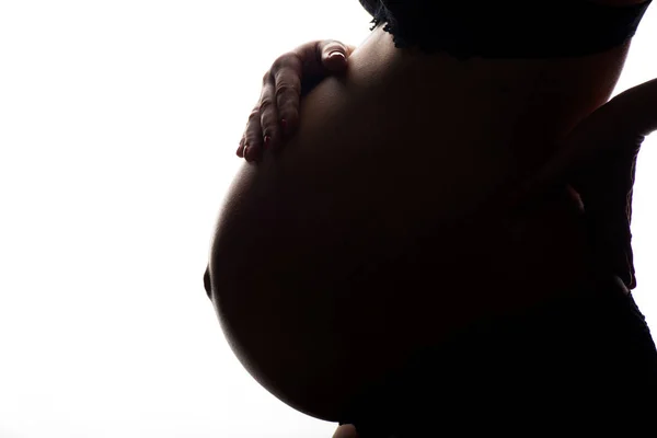Σιλουέτα του έγκυος γυναίκα σε λευκό φόντο — Φωτογραφία Αρχείου