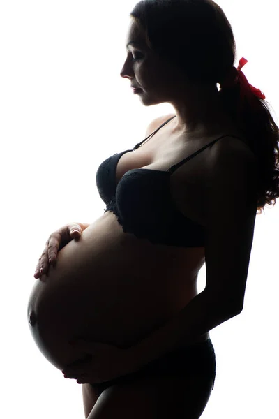 妊娠中の女性、白い背景にシルエット — ストック写真