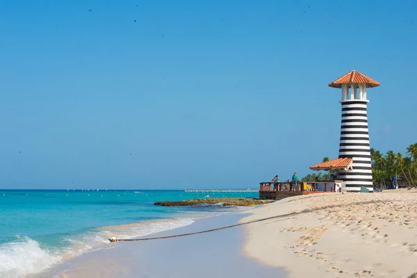 Striped red white lighthouse on the coast of the Caribbean Sea. Dominican Republic. — Stock Photo, Image