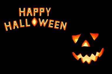 Mutlu Cadılar Bayramı Balkabağı siyah artalan üzerinde korkunç yüzü