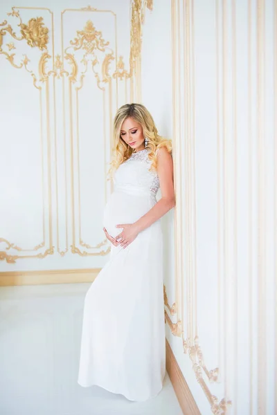 Pregnancy in a white lace dress. Waiting for the baby. — Stock Photo, Image