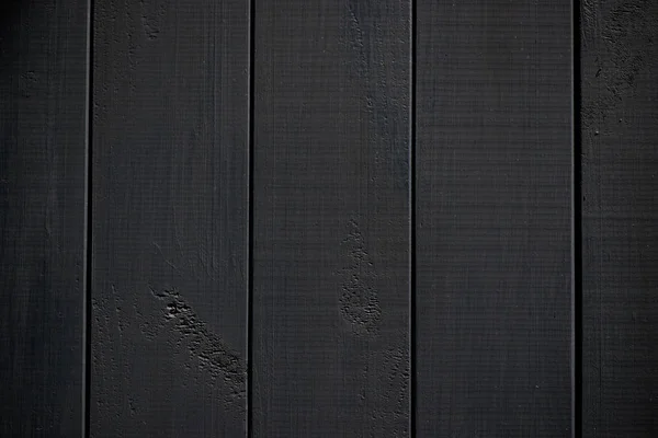 Struttura del legno. Tavola di legno nero con linee di fessura intemperie. Sfondo naturale per il design shabby chic. Immagine pavimento in legno nero. Modello di sfondo per primo piano con superficie ad albero invecchiata — Foto Stock