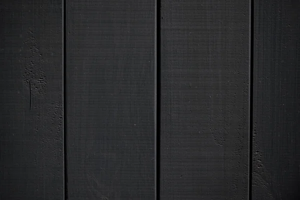 Tekstur kayu. Papan kayu hitam dengan garis retak lapuk. Latar belakang alami untuk desain chic lusuh. Gambar lantai kayu hitam. Templat latar belakang close-up permukaan pohon yang menua — Stok Foto