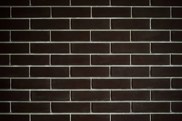 レンガの暗い壁、滑らかなパターンとテクスチャの背景. — ストック写真