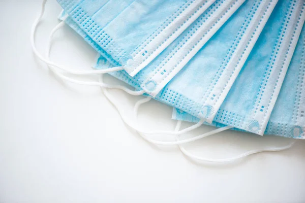 Close-up of a surgical medical mask isolated on a white background. The concept of protection against influenza virus, coronovirus covid-19.
