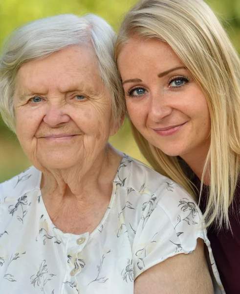 Grandmother and granddaughter posing — Stock Photo, Image