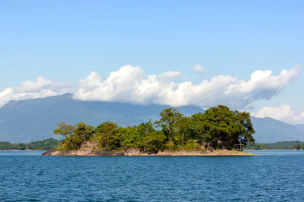 Small Island  in Nam Ngum Dam Landscape With Background Mountain On a clear day in Laos.
