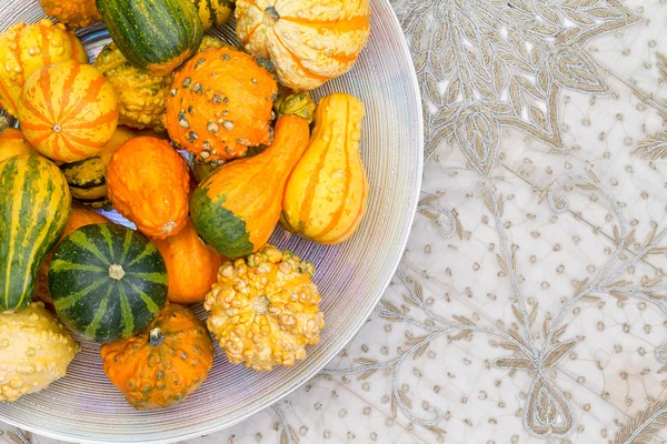 Table centerpiece with ornamental pumpkins — Stock Photo, Image