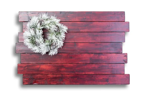 Målat trä yta med julen krans — Stockfoto
