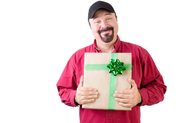 Proud single man in hat holding a Christmas gift — Stock Photo, Image