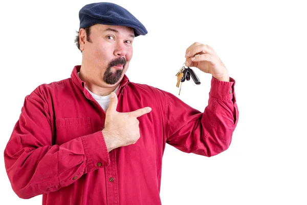 Jaunty proud big man pointing to his car keys — Stock Photo, Image