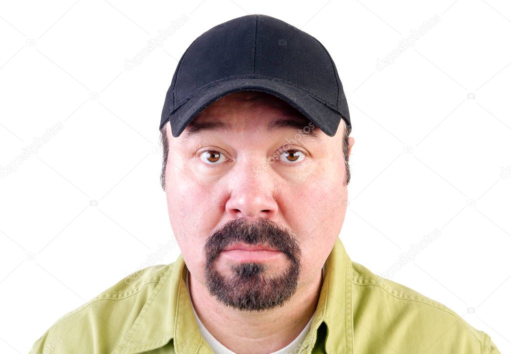 Portrait of staring man wearing baseball cap