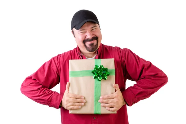 Excited man in baseball cap with wrapped present — Stock Photo, Image