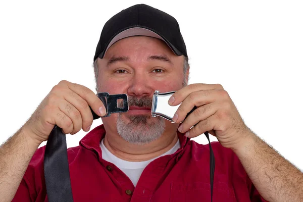 Middle-aged passenger demonstrating a seatbelt — Stock Photo, Image