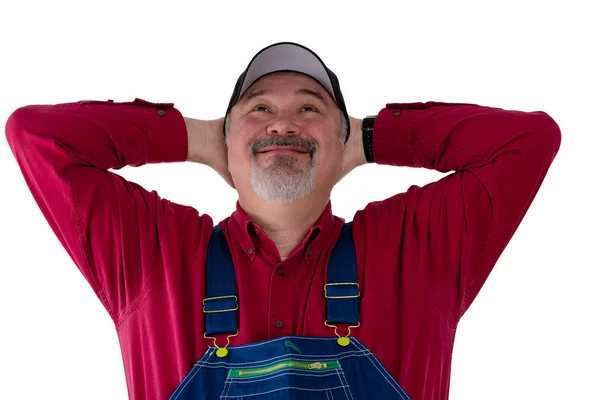 Pleased farmer or worker looking up beaming — Stock Photo, Image