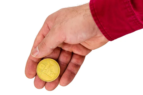 Hand with golden cryptocurrency coin — Stock Photo, Image