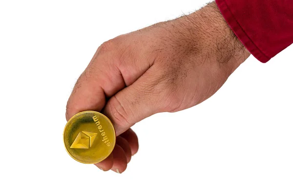 Hand med ethereum kryptovaluta mynt — Stockfoto