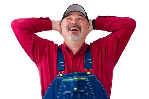 Trabajador feliz vistiendo dungarees sobre fondo blanco —  Fotos de Stock