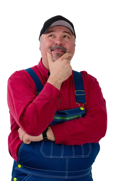 Thoughtful blue collar worker wearing dungarees — Stock Photo, Image