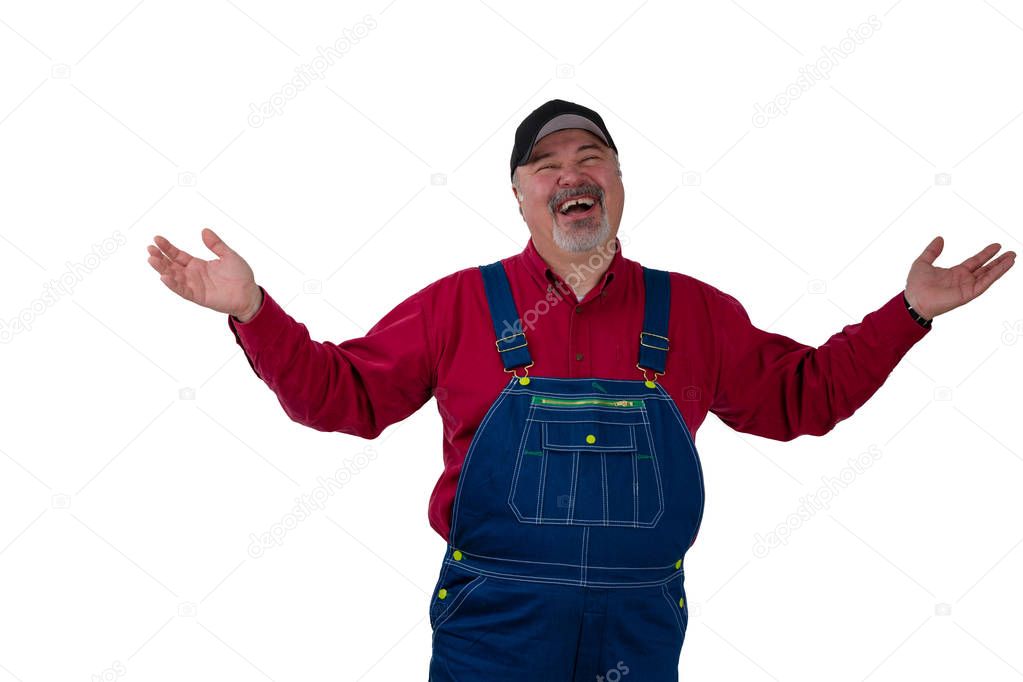 Laughing happy man in dungarees raising his arms