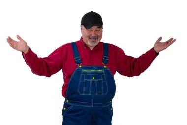 Mature man in overalls gesturing with raised palms clipart