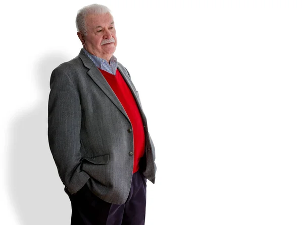 Forgetful elderly man standing thinking — Stock Photo, Image