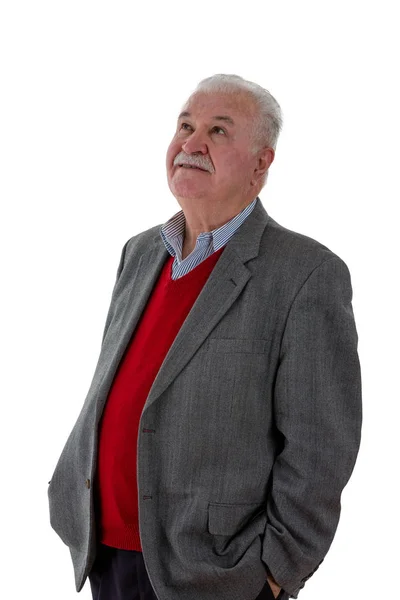 Grey-haired elderly man standing thinking — Stock Photo, Image