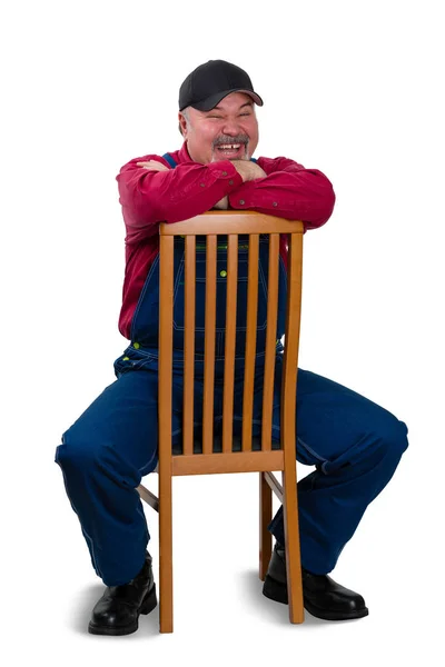 Jovialisk livlig arbetare sittande skrattande — Stockfoto