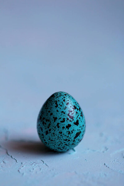 Blue Easter egg on a blue background