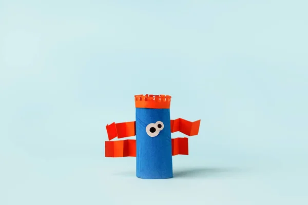 Antistress art therapy for kids, coronavirus pandemic, monsters for Halloween party. Easy crafts for kids on blue background, copy space, diy creative idea from toilet tube, recycle concept