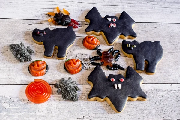 Bats and cats halloween cookies and fruit jelly — Stock Photo, Image