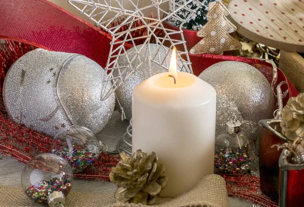 Lighting Christmas candle — Stock Photo, Image