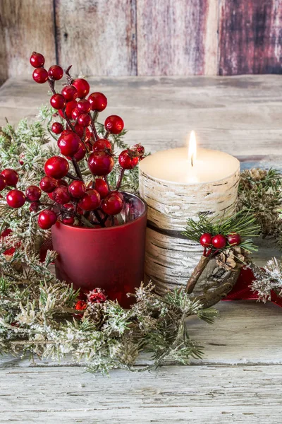 Lit candle and a stick of cranberries — Stock Photo, Image